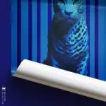 "Dream" - A majestic blue jaguar stands alert against a deep blue background, encouraging viewers to dream, alongside the text "La Tierra de los Sueños" and a musical code.