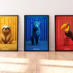Triptych display of "Inspirational Fauna" series by @estyhimself featuring a sloth, jaguar, and toucan against a cohesive backdrop of the Colombian flag's yellow, blue, and red, each paired with motivational words and scannable Spotify codes.